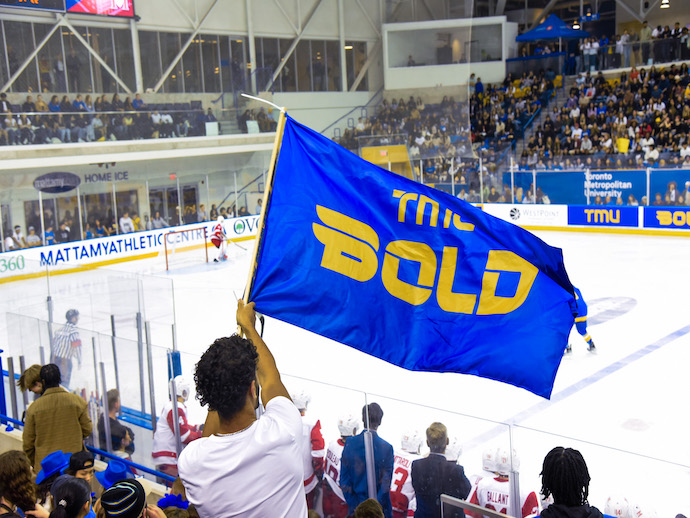 TMU Bold flag at hockey game