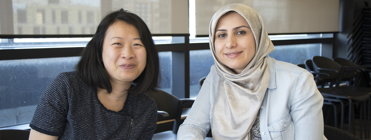 Two employees enjoying lunch at the Muslim Employee Community Network kickoff event.