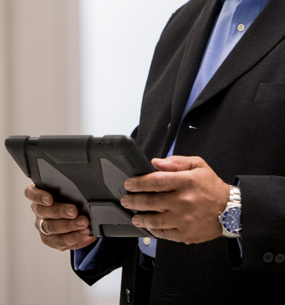 Person holding tablet.