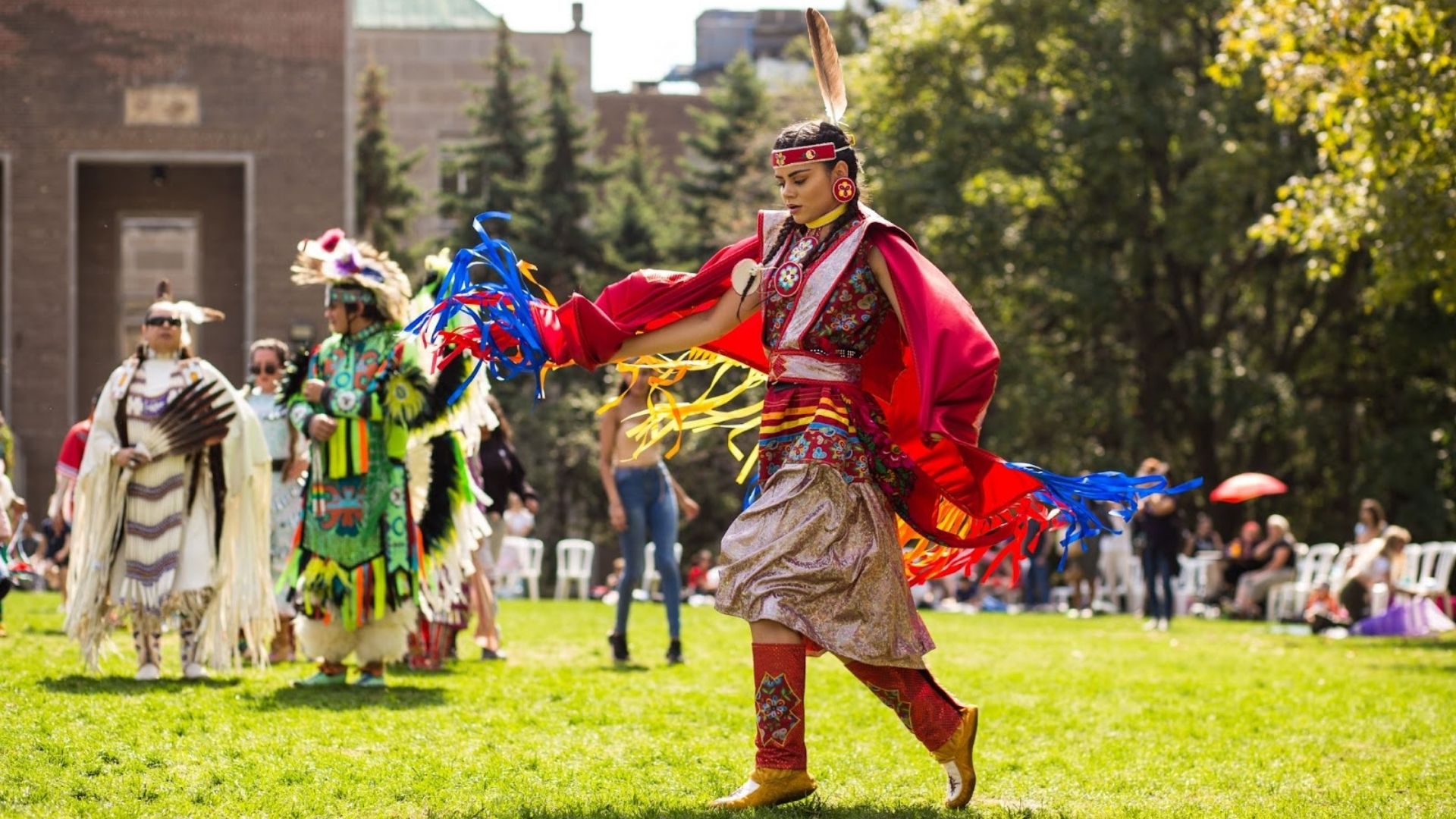 Indigenous Powwow dancer dressed in traditional outfit.