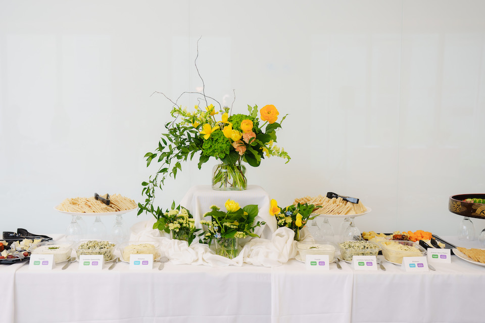 A flower arrangement and food on a table