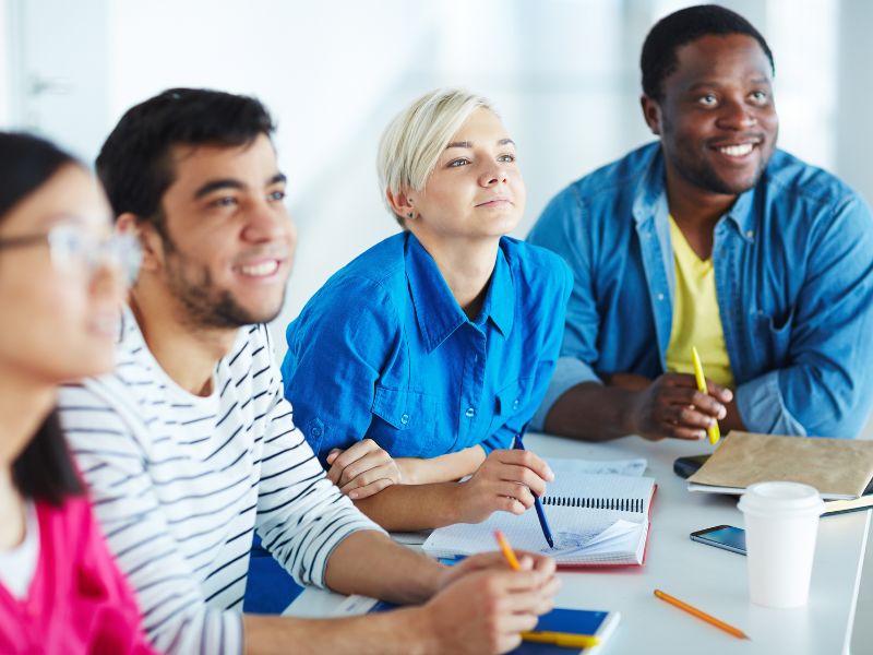 A group of students sitting together a table