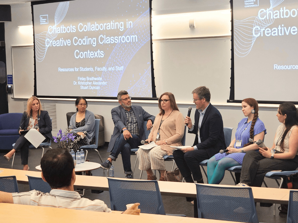 A panel discussion showing a conversation among TMU professors