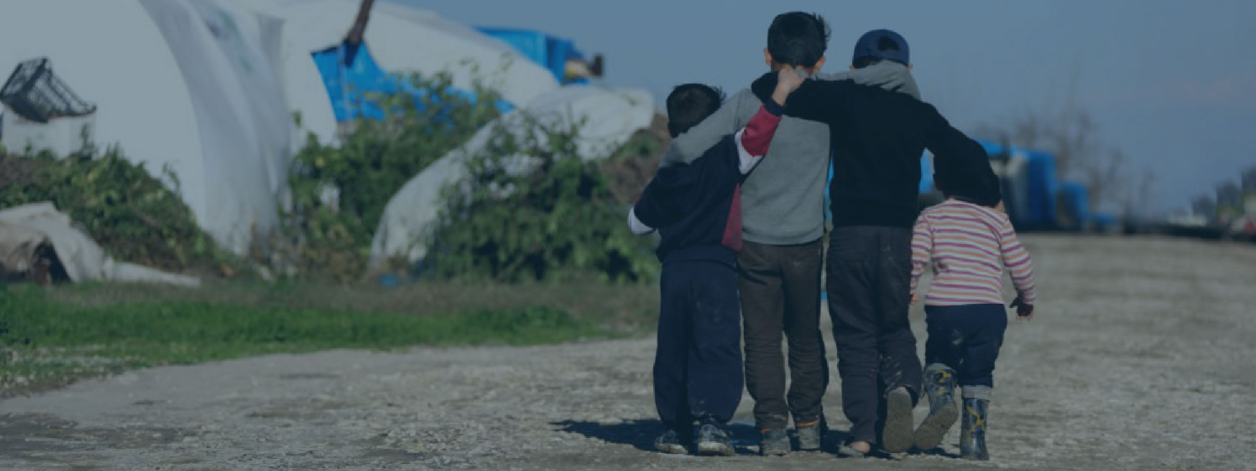 Children walking at a Syrian refugee camp