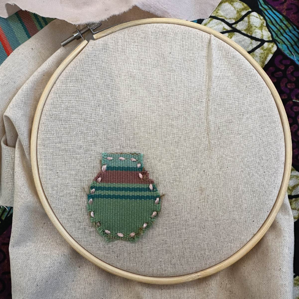 Embroidery hoop with textile