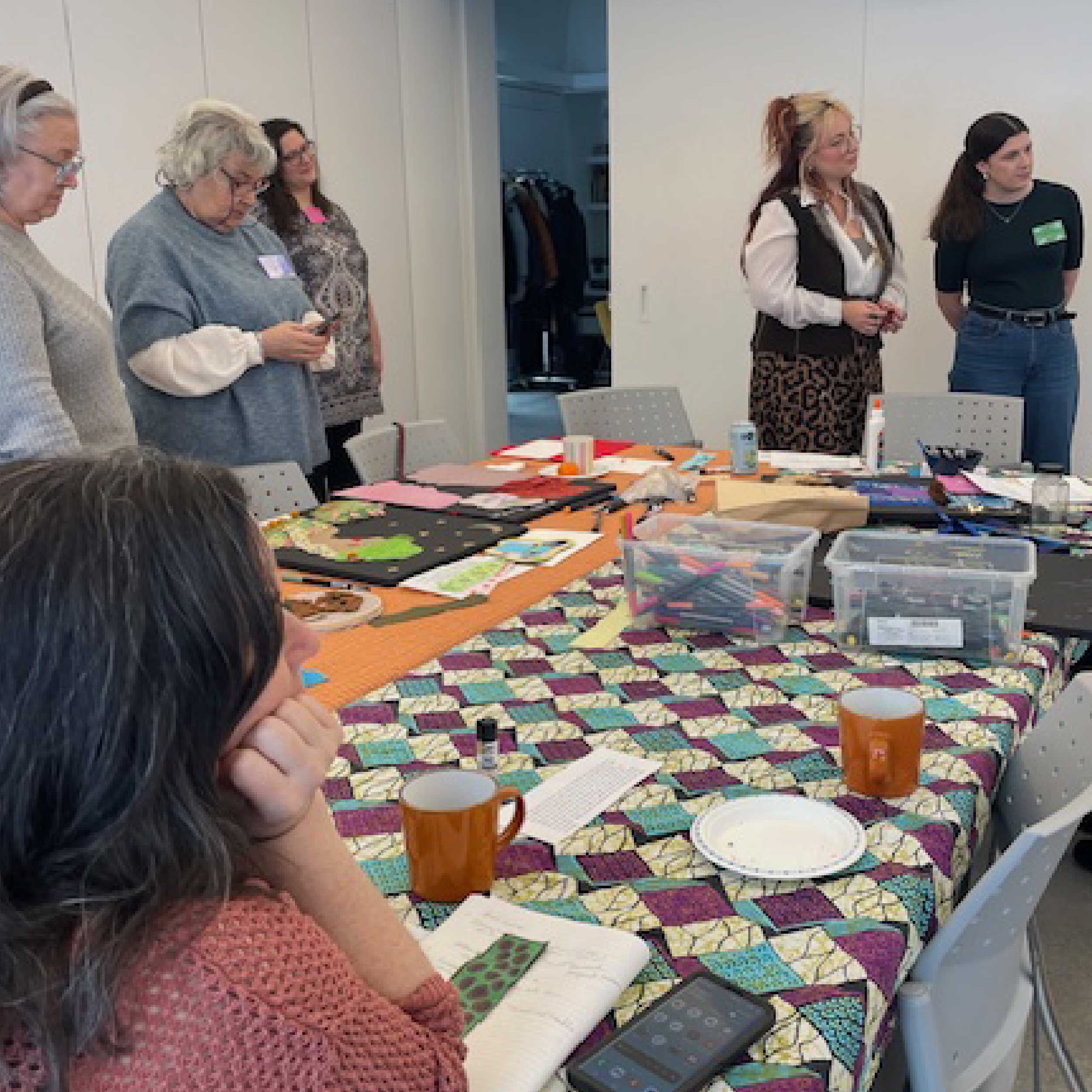 Mabelle Arts group table with people