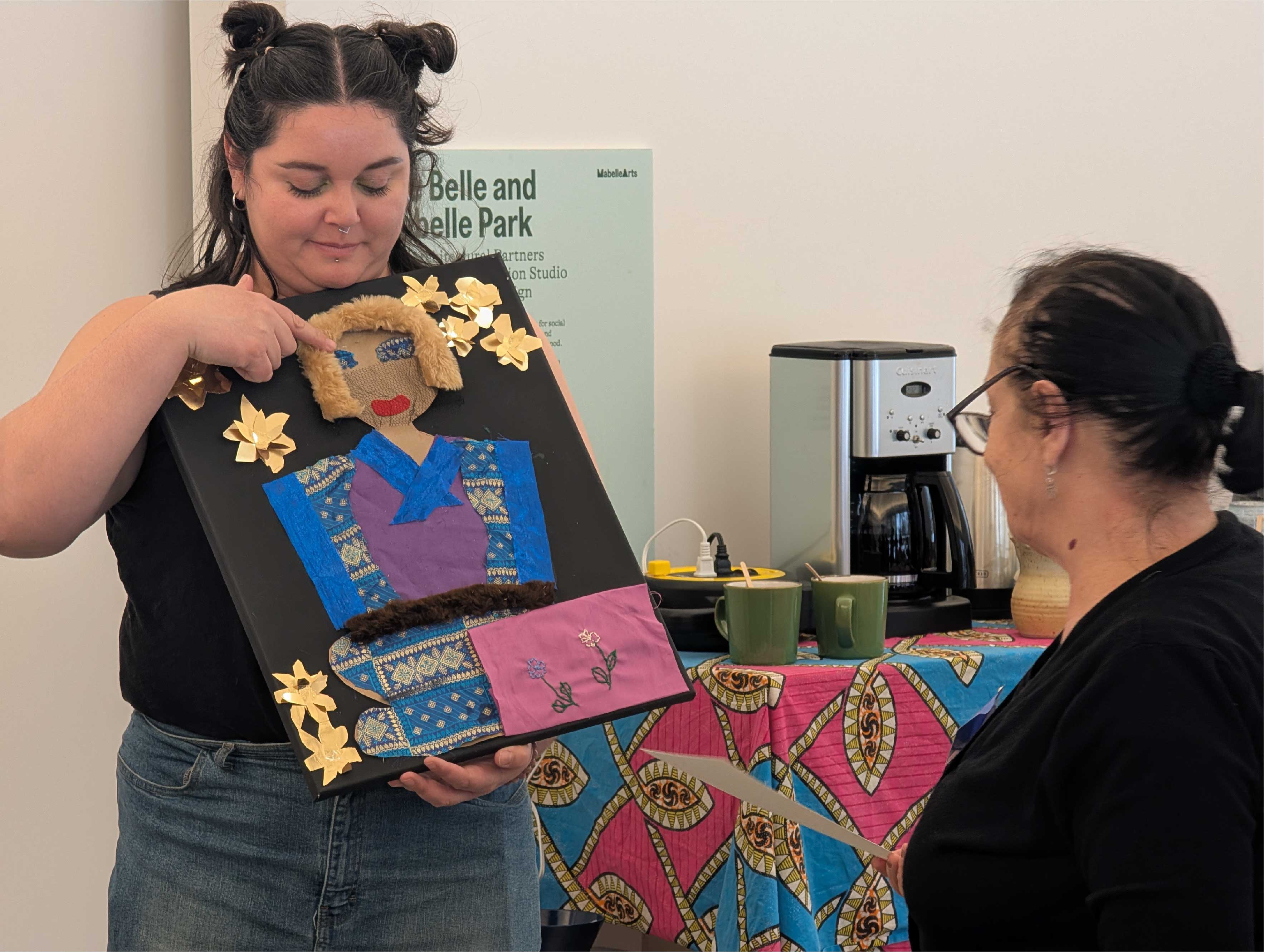 Mabelle Arts participant holding their craft
