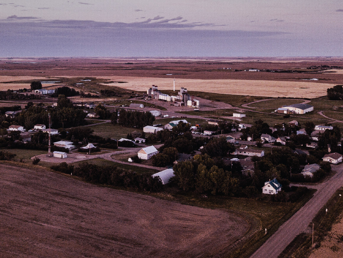 Aerial of village with houses and fields in Saskatchewan