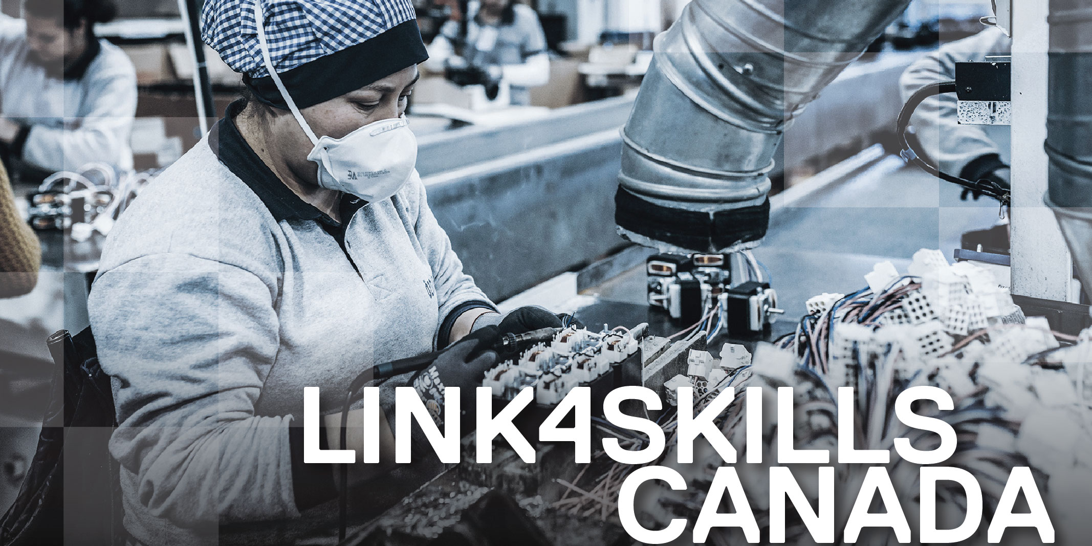 Image of a lady assembling wires in a factory