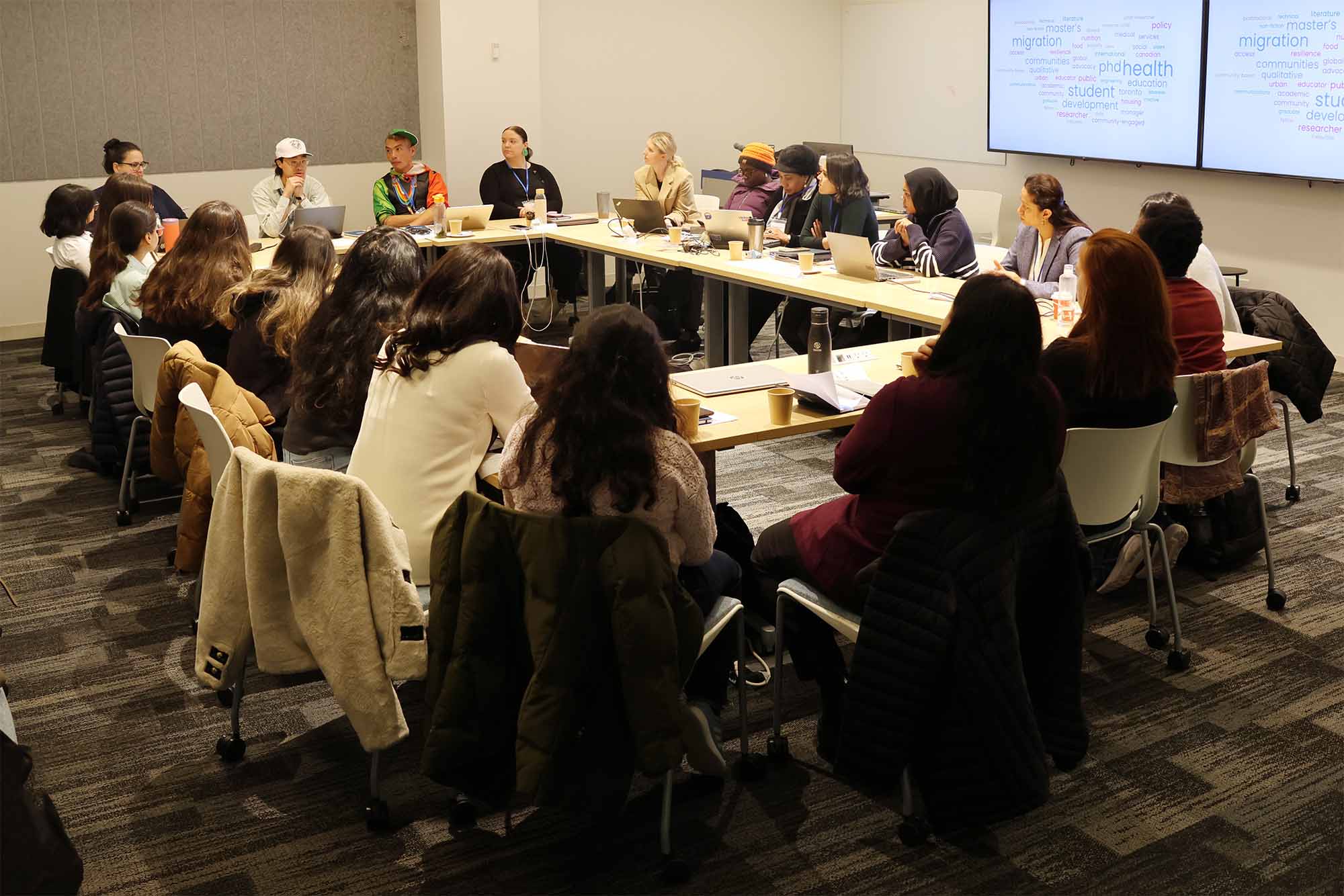 Winter School participants sitting in a conference room