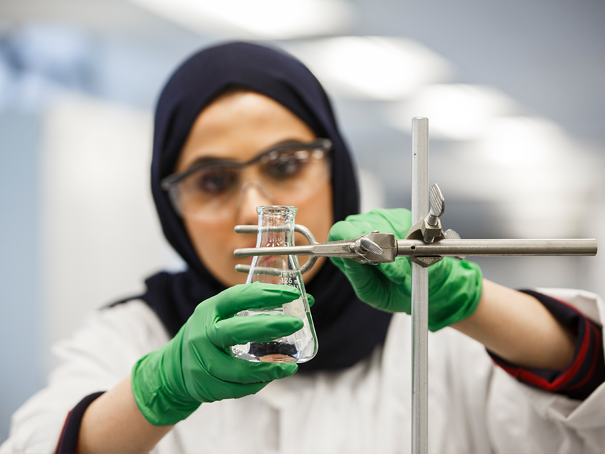 Closeup Of Student Using Lab Equipment