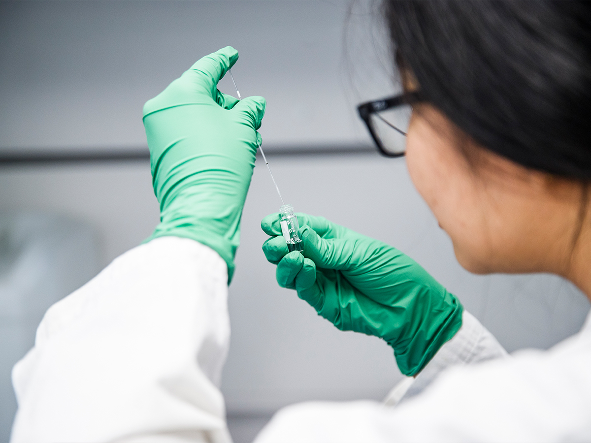 Closeup Of Student With Vial