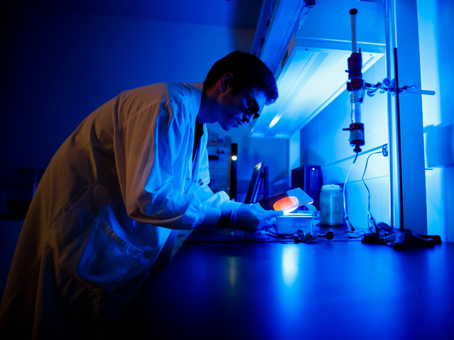 Chemistry and Biology student working on biomedicine research in lab