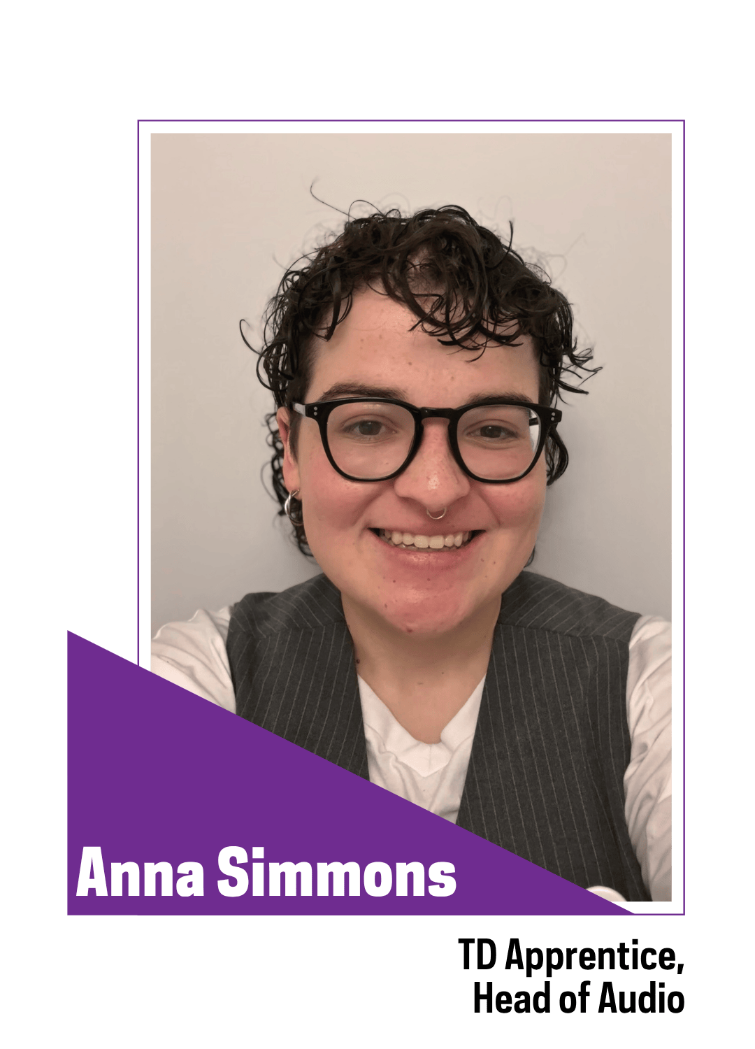 Smiling person with galssses waring a gray sweater vest