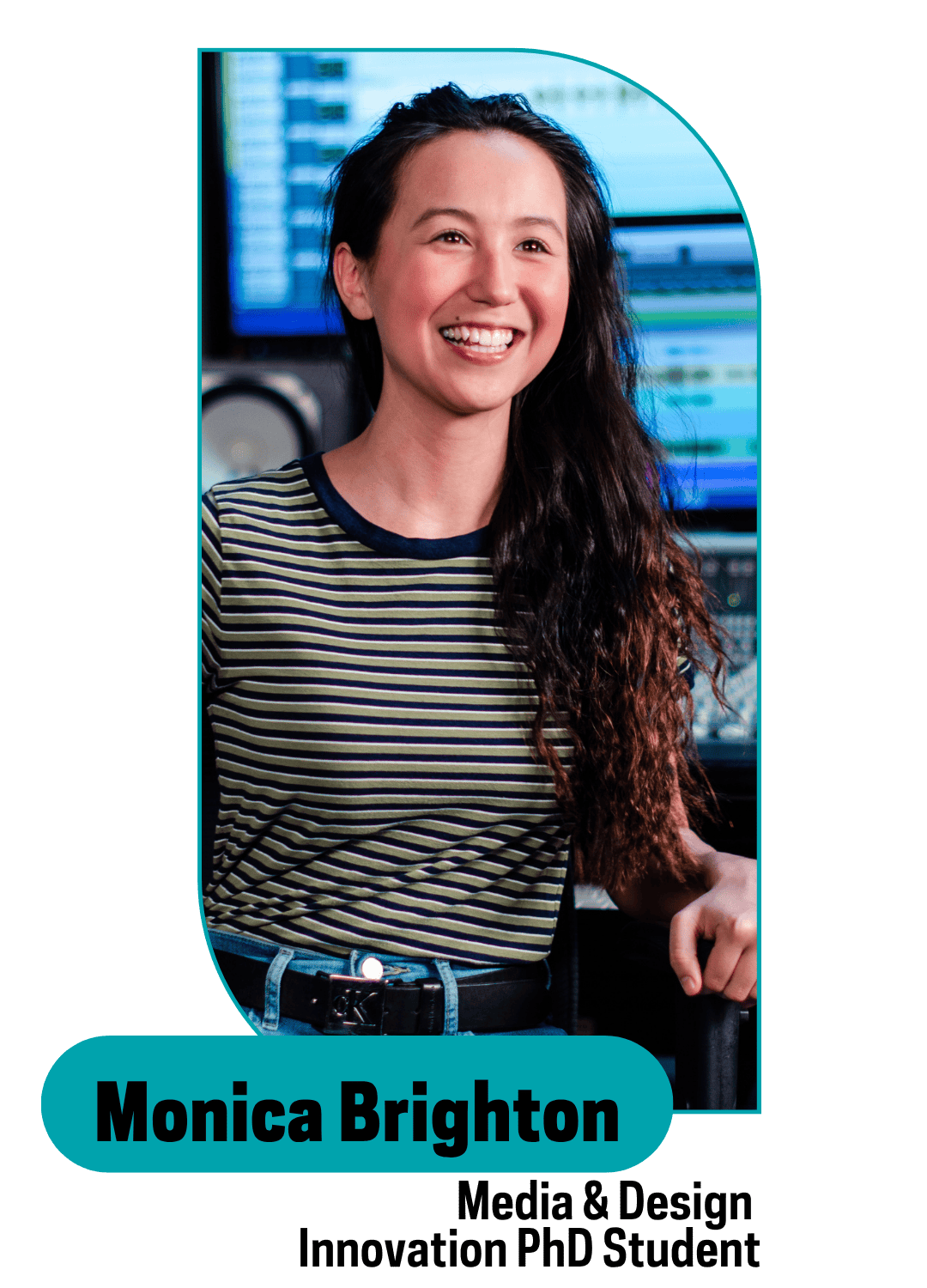 curly haired smiling girl with stripped t-shirt sitting down