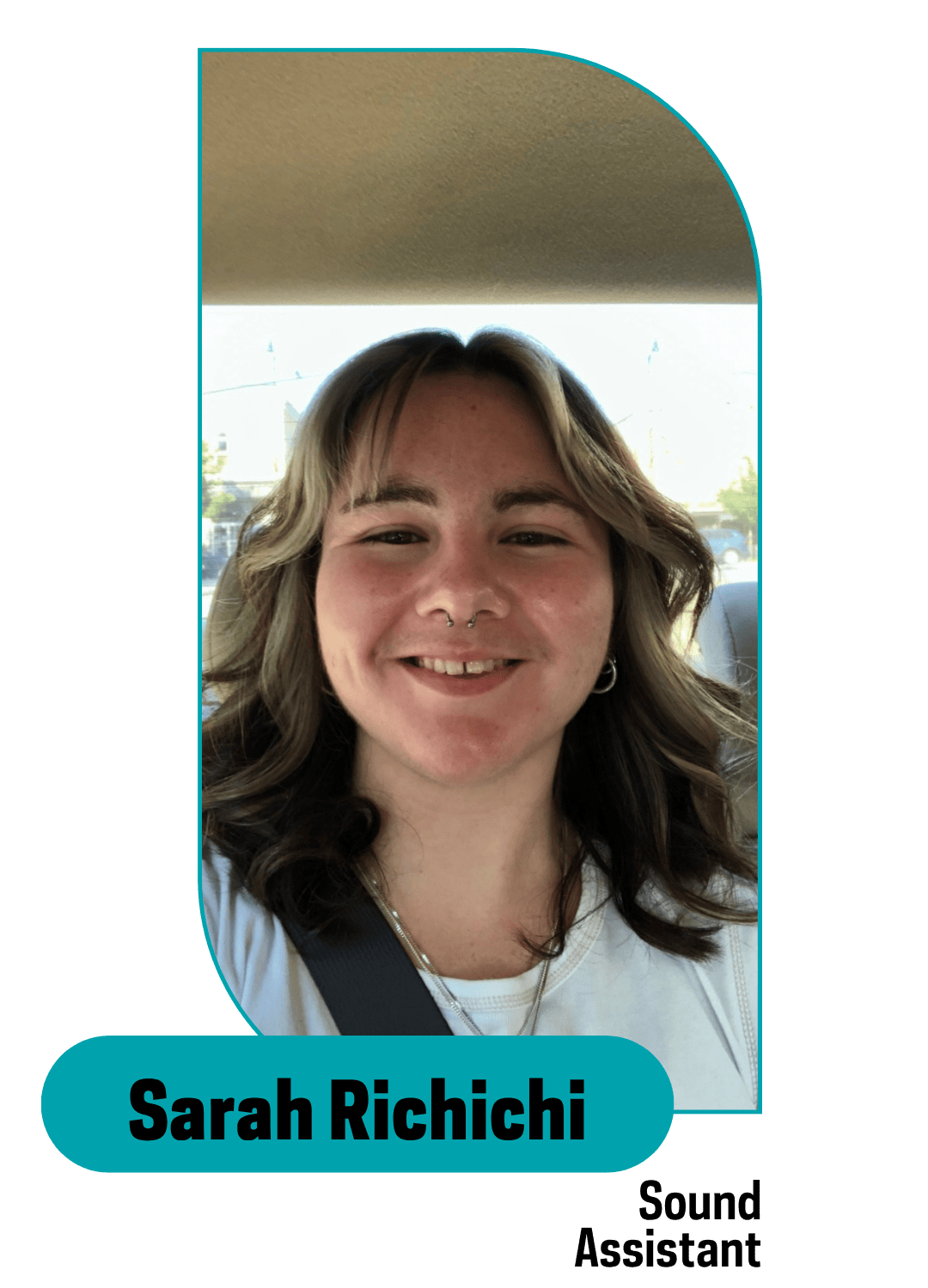 smiling girl with hilighlights in her hair sitting in a car