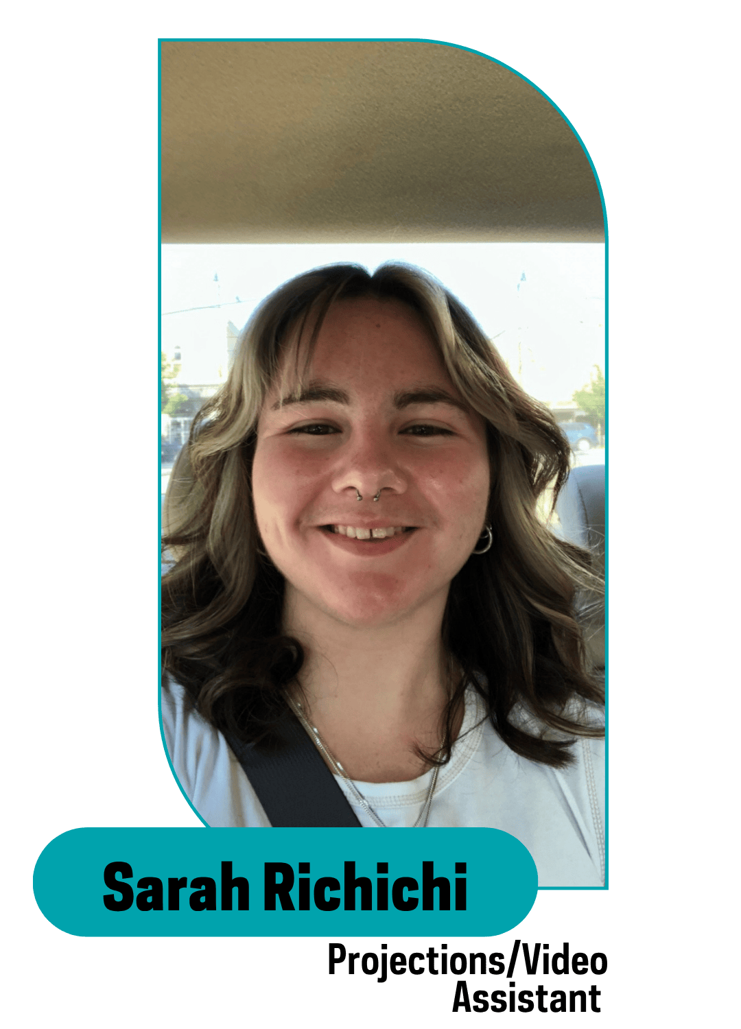 smiling girl with hilighlights in her hair sitting in a car