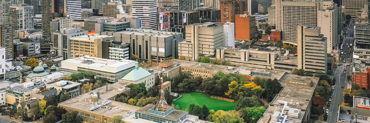 An aerial view of TMU campus with the Quad and lush green grass in the centre.