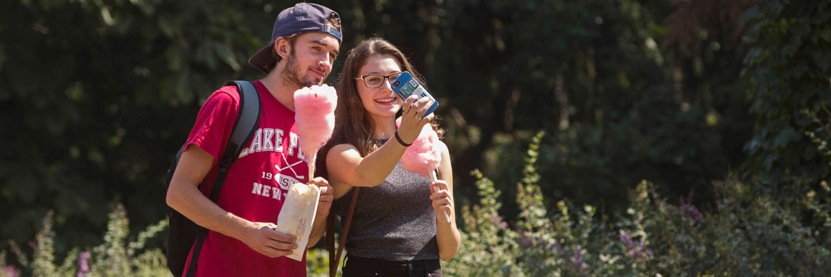 Two students taking a selfie with their mobile phone.