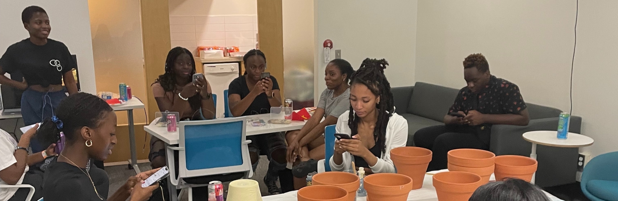 Eight Black students sitting in the Black Student Lounge