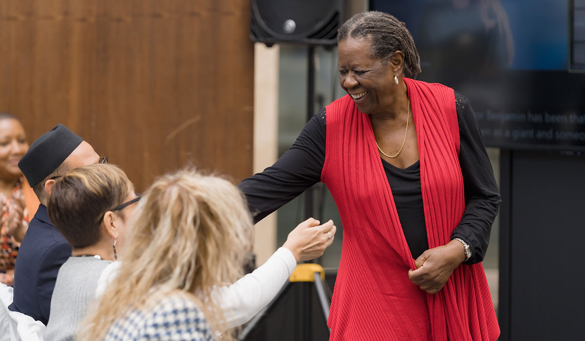 Akua Benjamin greeting colleagues at the Alan Shepard Equity, Diversity and Inclusion Awards. 