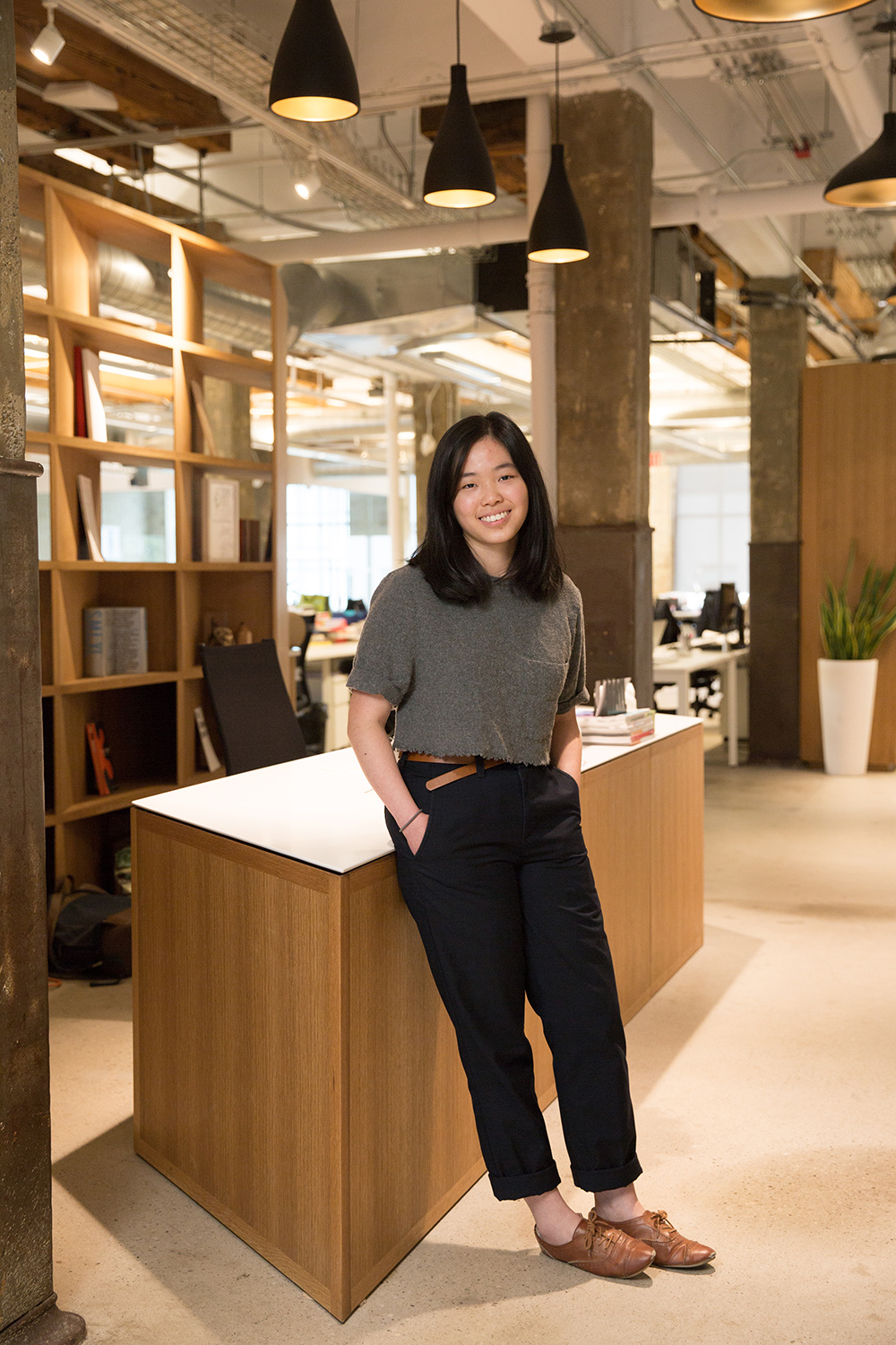 Three students discussing and studing with post it notes