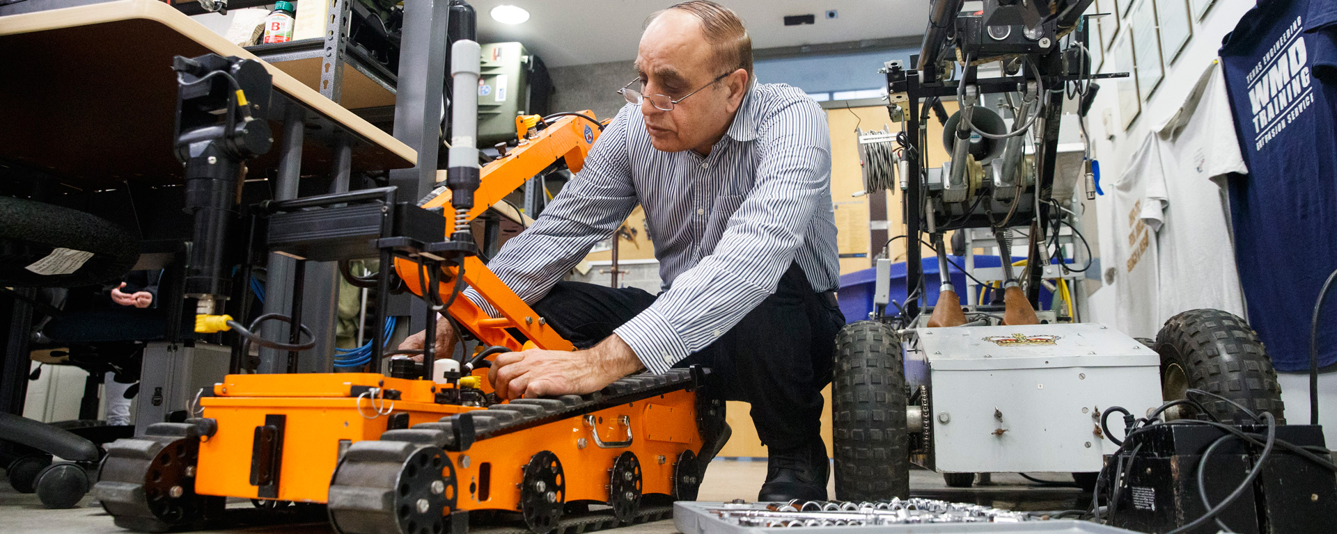 Robotics researcher working on robotic in the lab.