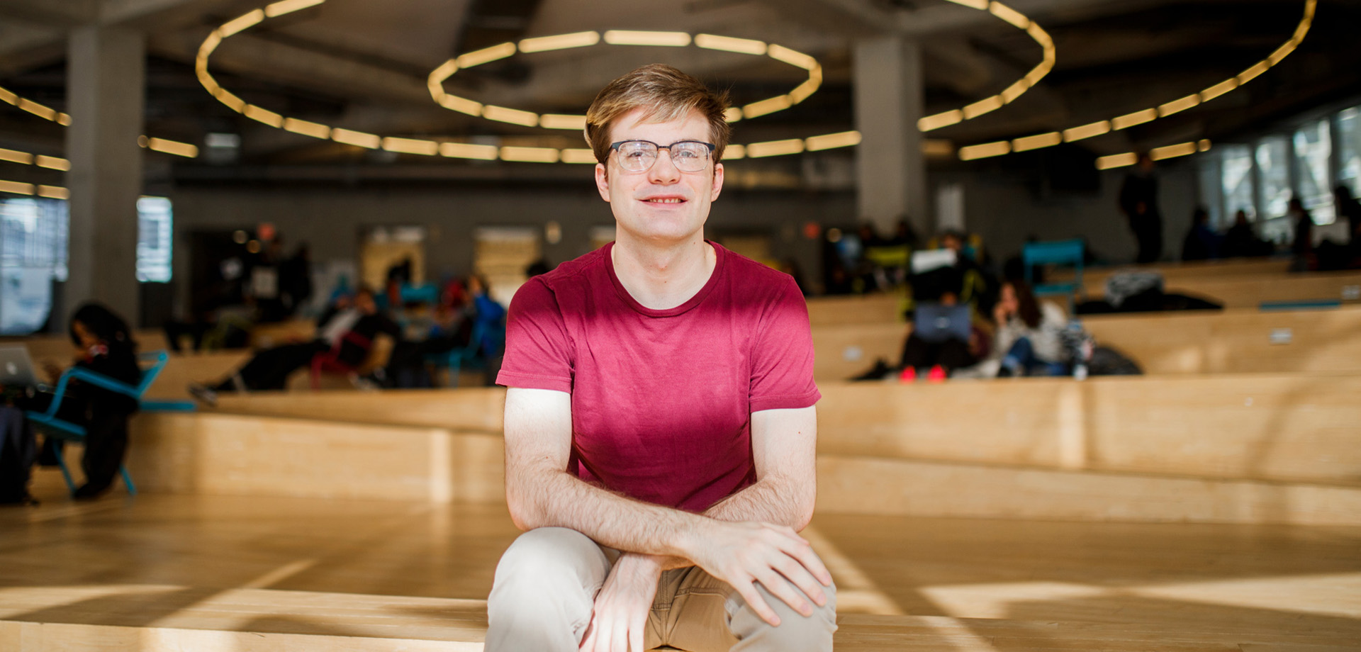 Computer science future undergraduate student sitting in SLC.