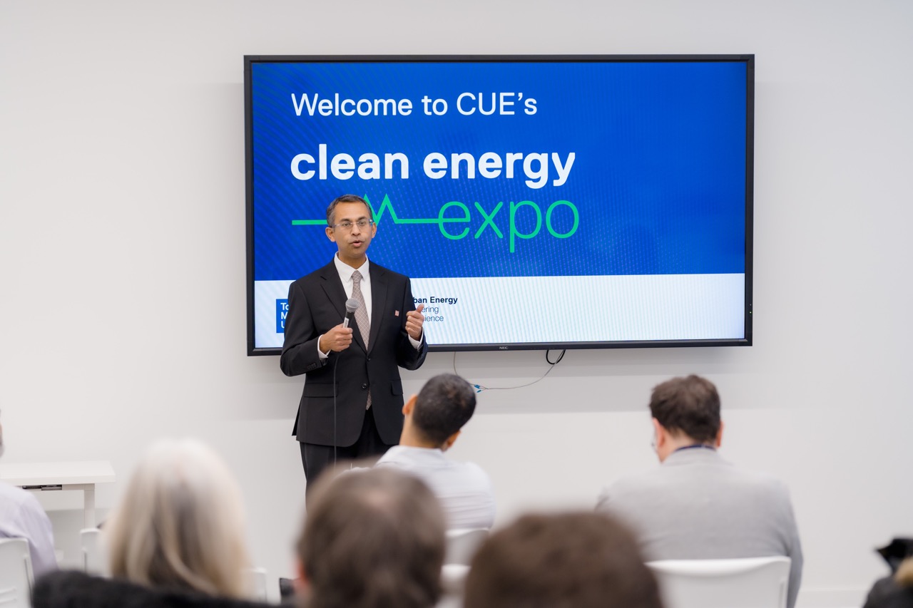 Dr. Bala Venkatesh welcoming guests to the Clean Energy Expo