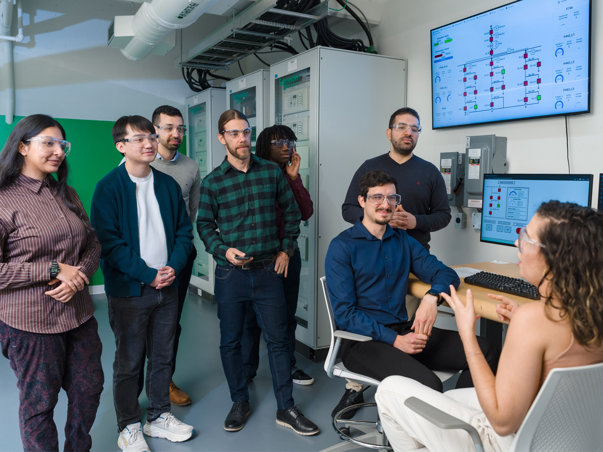 3 Researchers in the lab, looking at graphs together