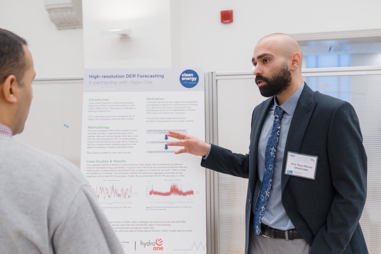 Academic researcher presenting information to a colleague