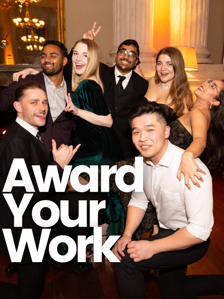 A group of undergraduate students dressed in formal attire laugh and pose next to the text "Award Your Work." 