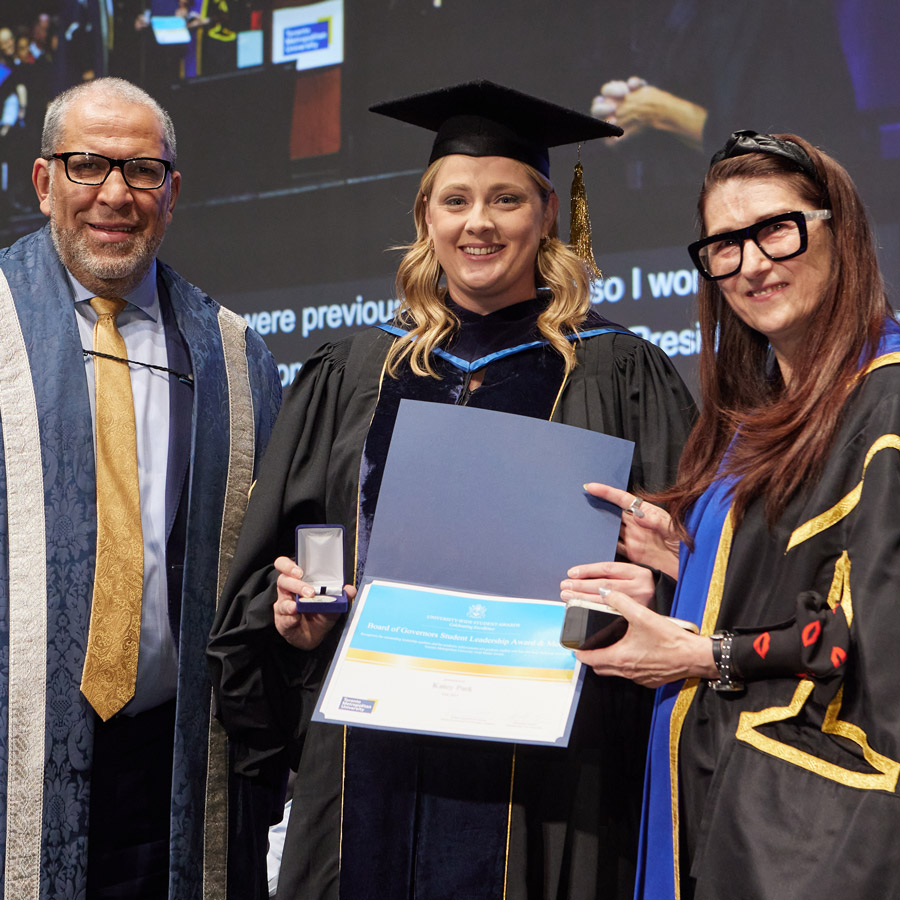 The recipient of the Board of Governors Student Leadership Award & Medal celebrates their prestigious win at the TMU fall convocation ceremony.