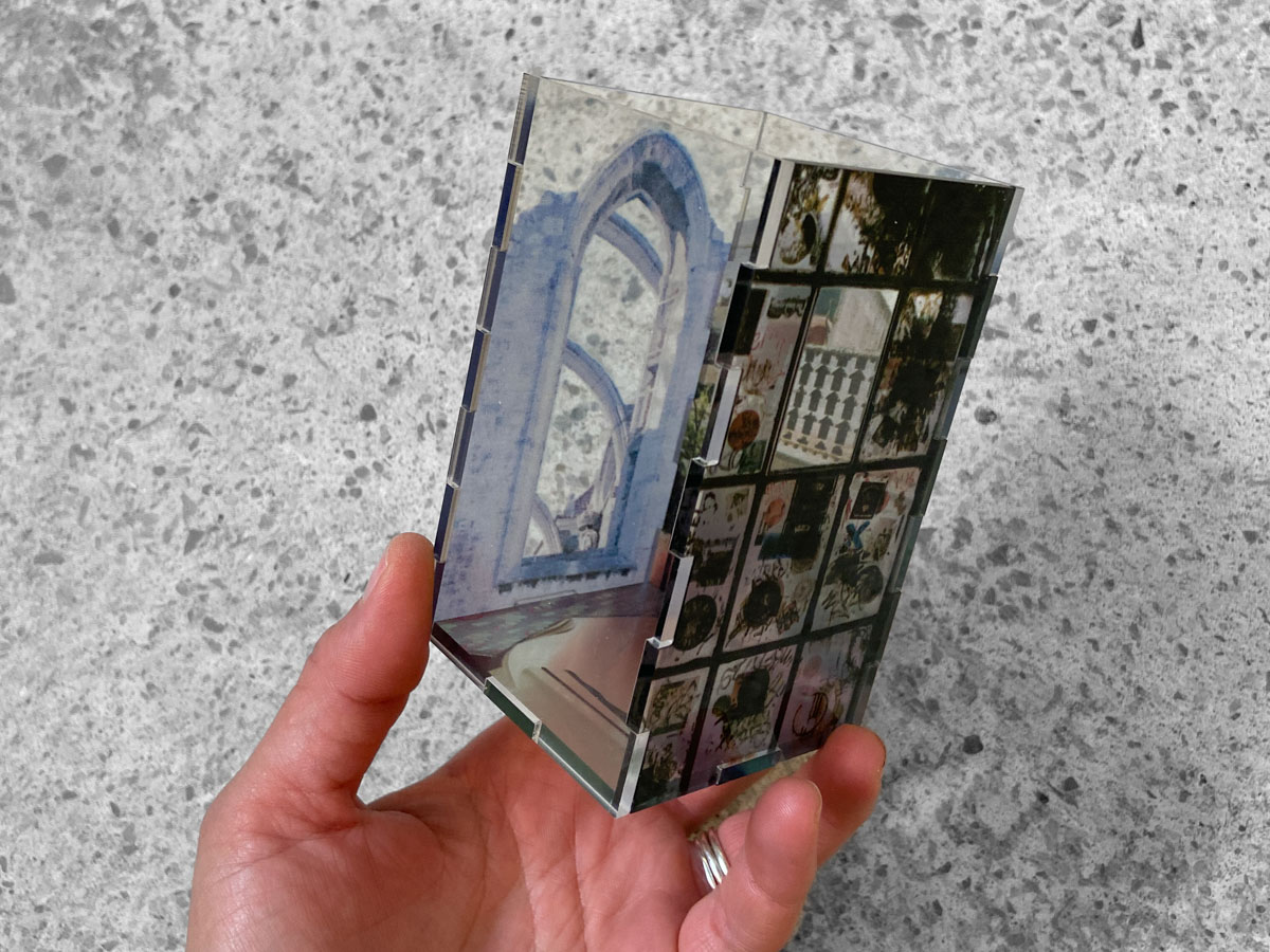 A technician operating a flatbed UV ink printer