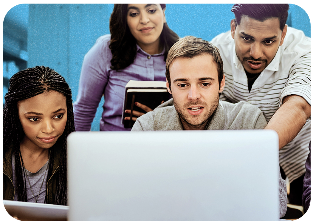 Students and instructor gathered around a laptop in the library