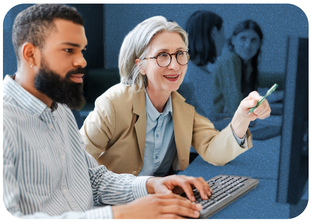 Colleagues reviewing work on a computer.