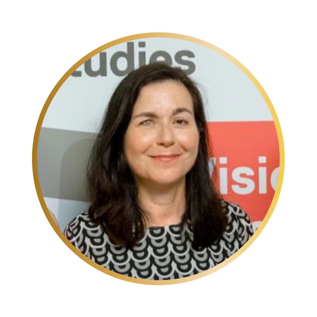 A photo of a white woman with long brown hair with a visable eye disability