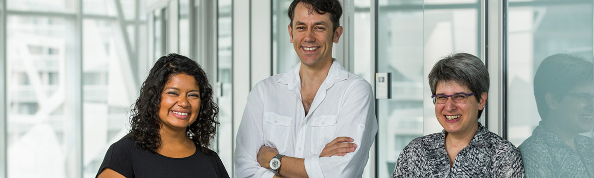 Three TMU staff members posing for the camera