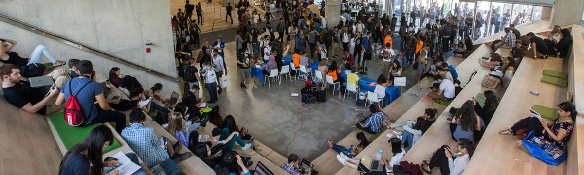 Large group of TMU students gathering in the SLC atrium