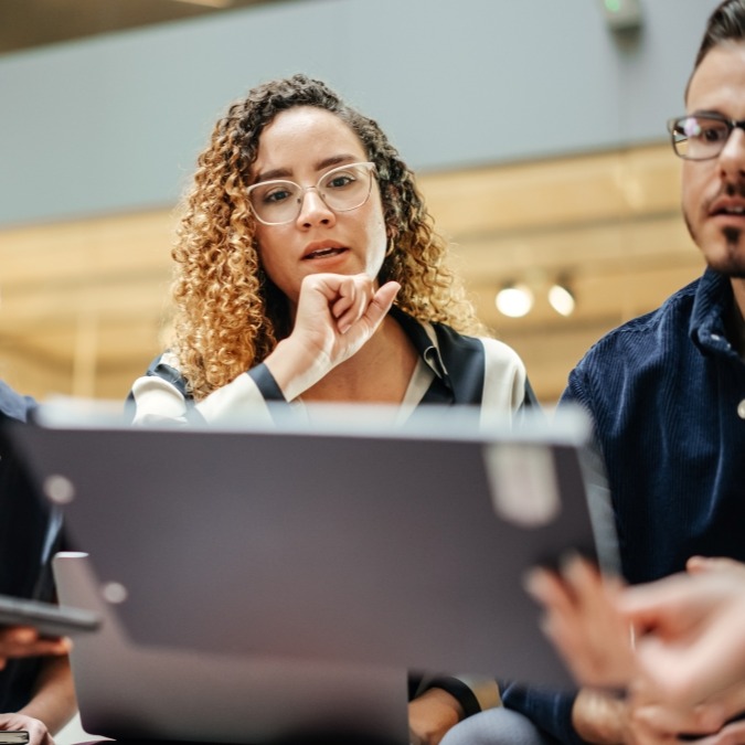 Two people looking at a tablet computer.