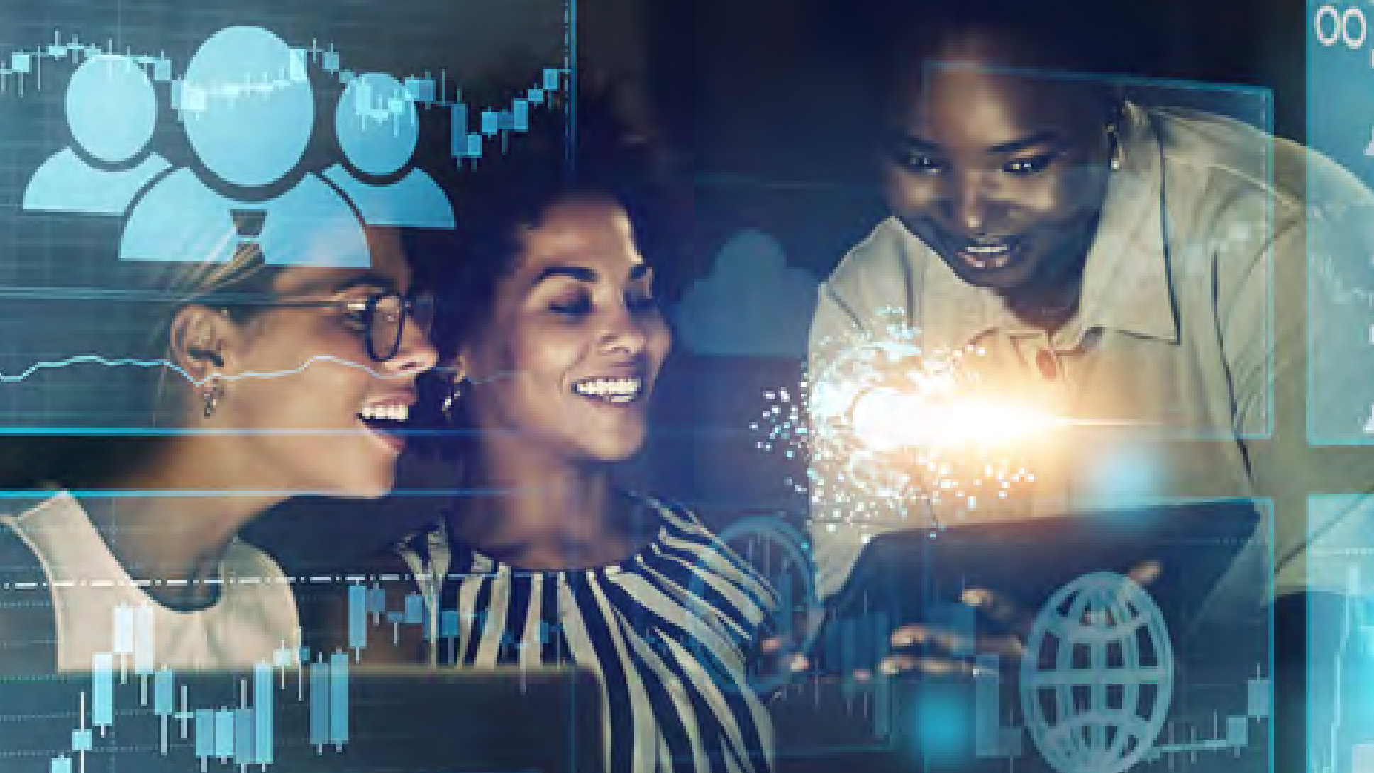 Group of three women working at a computer.