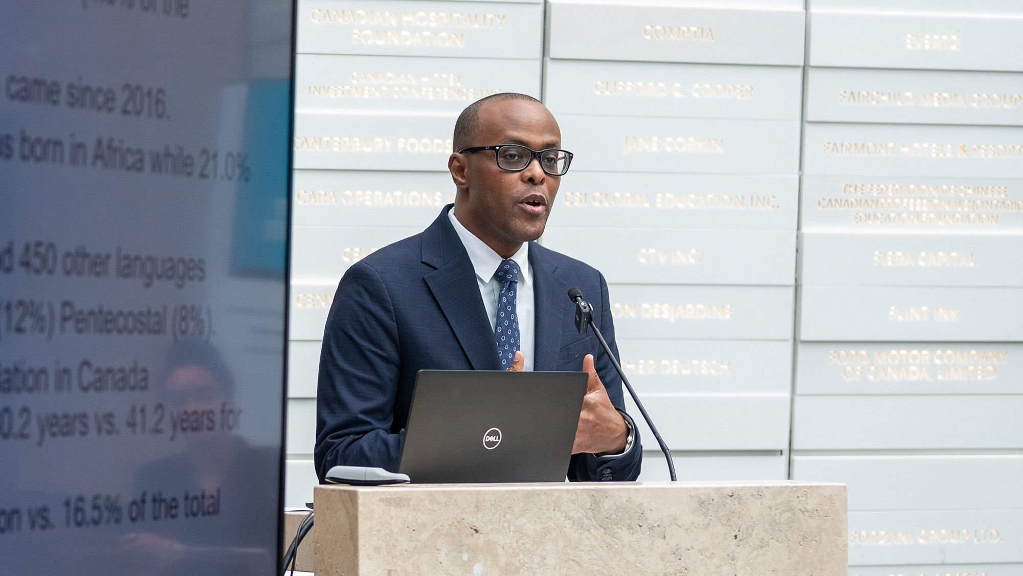 A man delivers a speech at a podium.