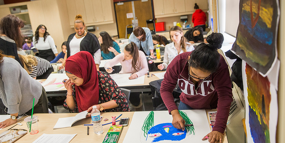 A grown man and a child are playing with toys