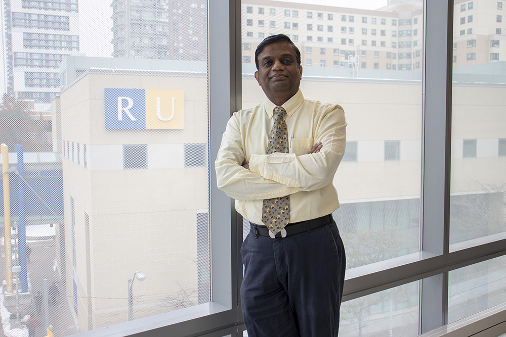 Professor Karthi Umapathy poses near a window in the George Vari Engineering and Computing Centre.