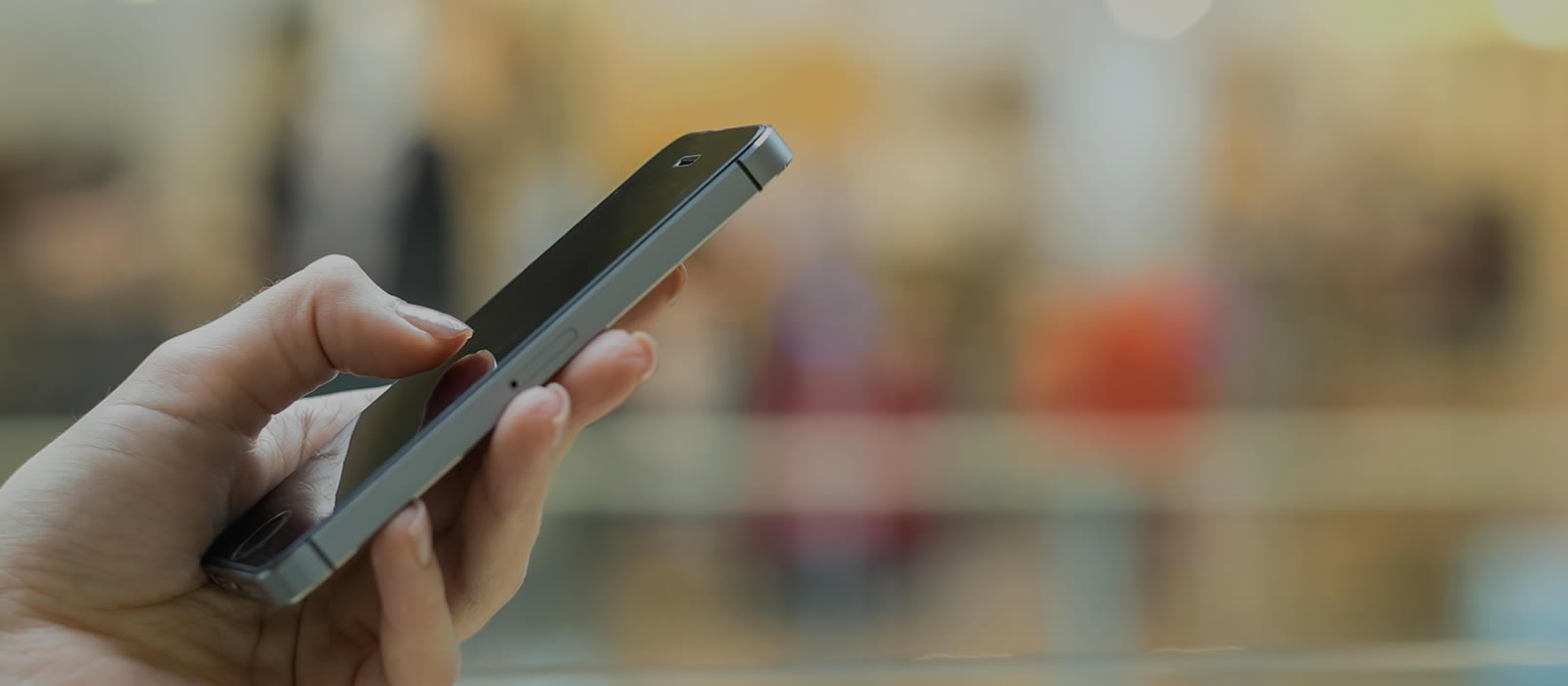 An indiviudal using a cell phone to contact someone