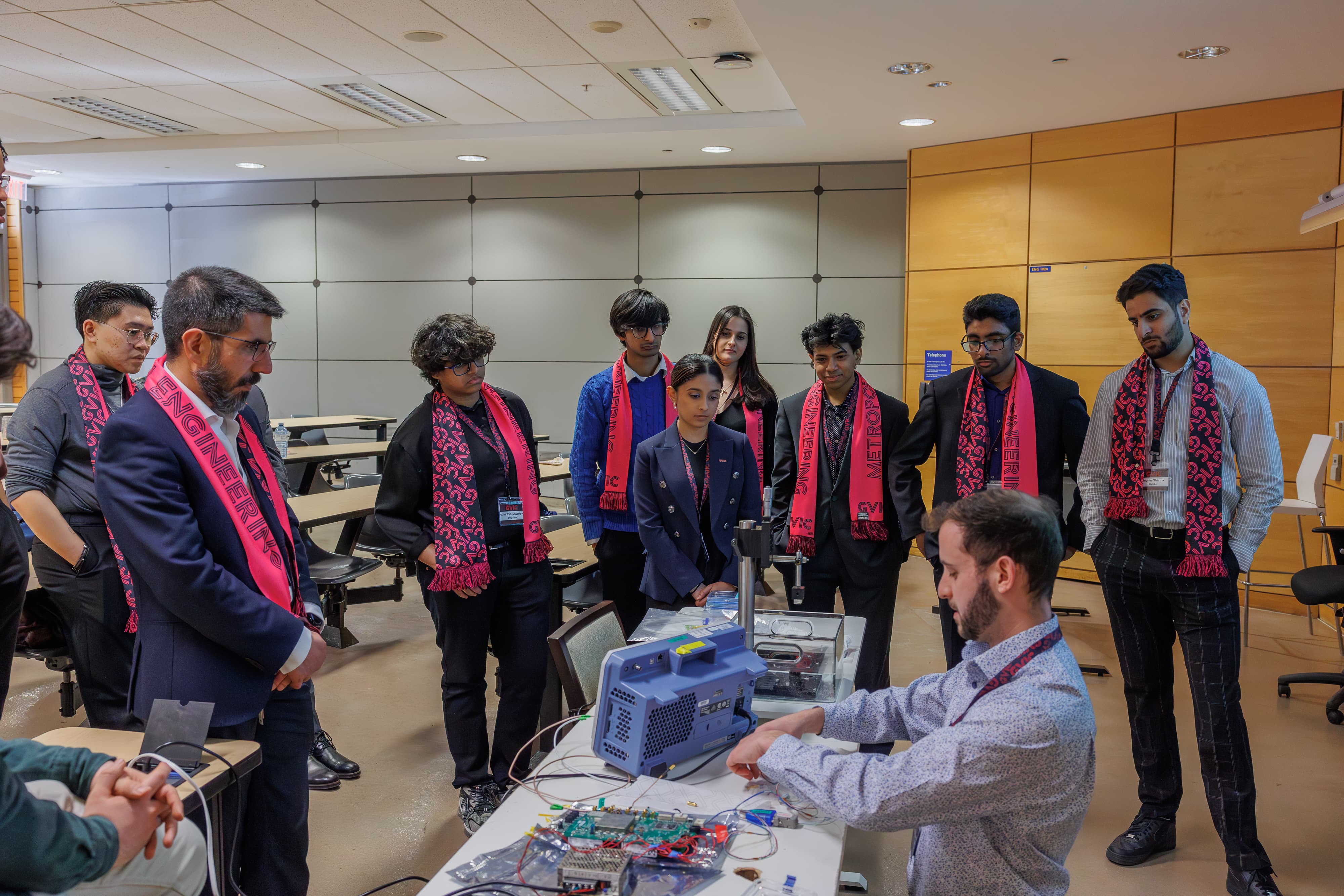 Liam Bell providing a live demonstration while students watch attentively 