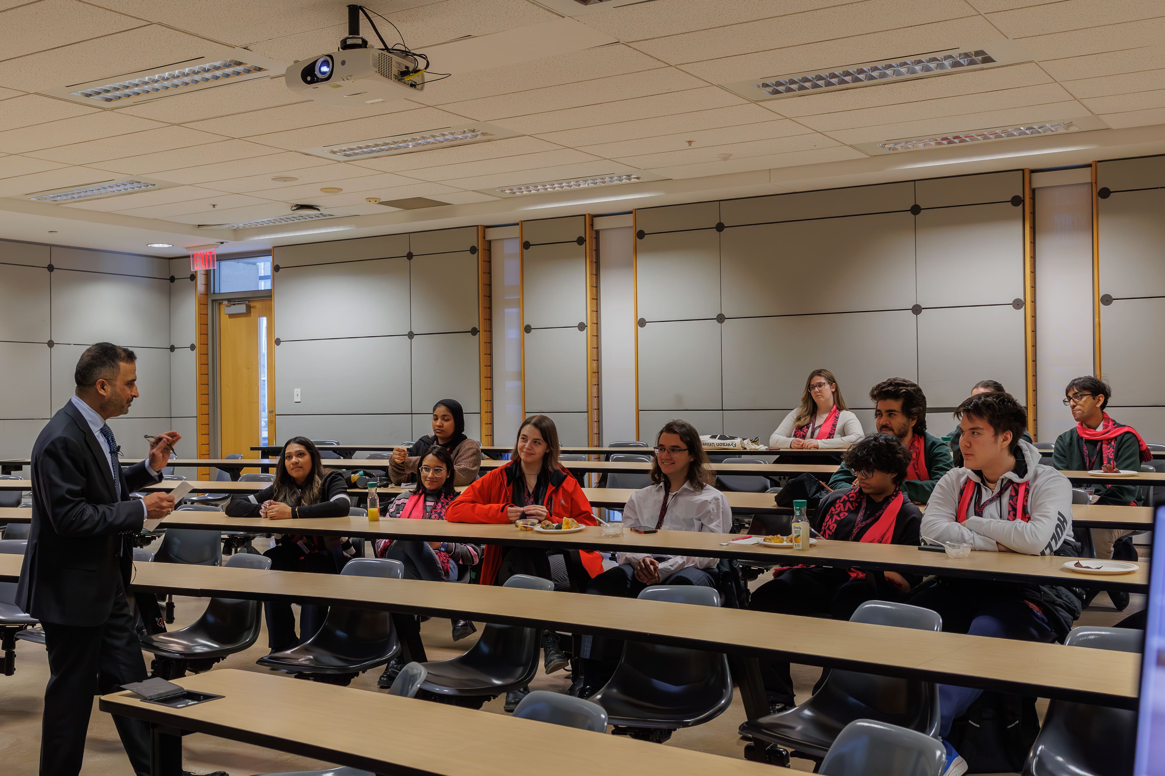 Ali Tharia teaching his workshop as students listen