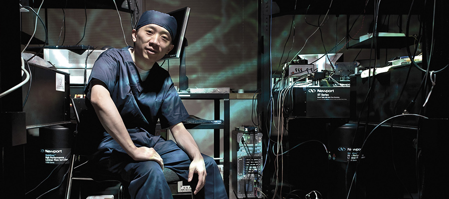 Professor Victor Yang sits in a medical room