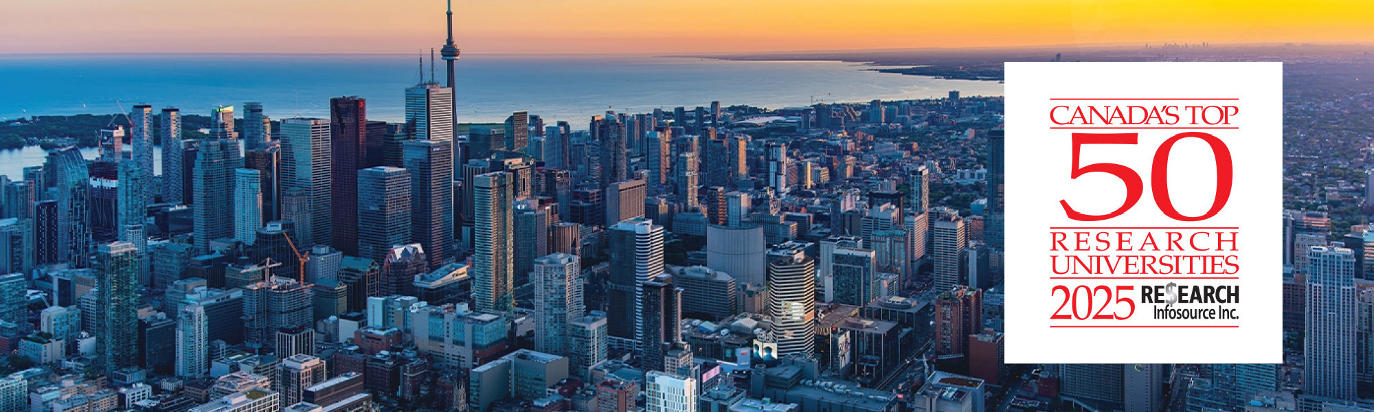 Birds-eye view of the City of Toronto with an orange sunset in the background.