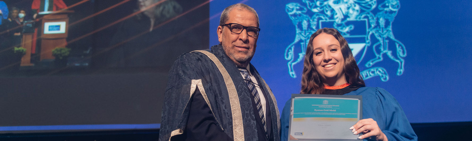 Erica Attard receives the university Gold medal for FEAS from President Lachemi during convocation